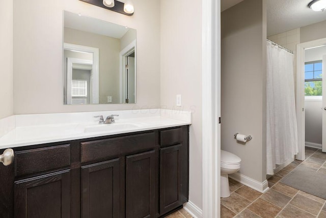 1211 Mcclish Ct, Grove City, OH 43123 - full bathroom with toilet, vanity, baseboards, and stone finish floors