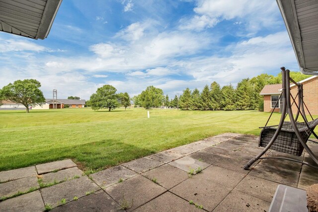 106 Kings Way W, Jefferson, OH 43162 - view of grassy yard featuring a patio area