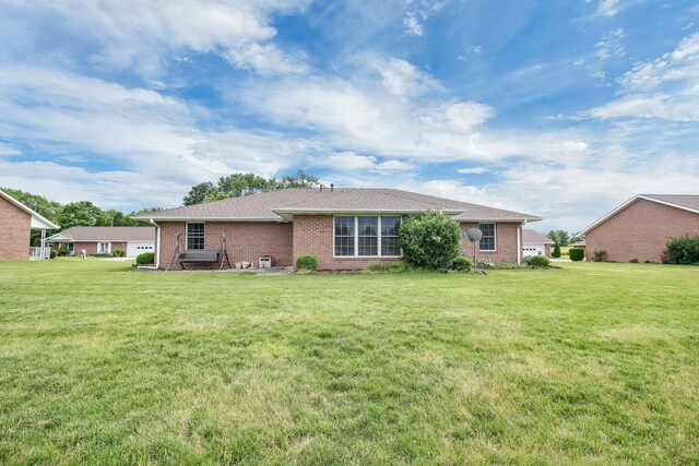 106 Kings Way W, Jefferson, OH 43162 - rear view of house with brick siding and a yard