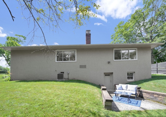 2608 Edgevale Rd, Columbus, OH 43221 - back of house with stucco siding, a chimney, outdoor lounge area, and a patio area