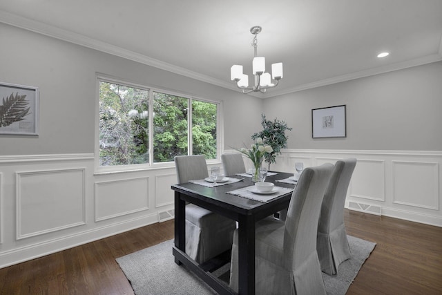 2608 Edgevale Rd, Columbus, OH 43221 - dining room featuring a chandelier, wainscoting, ornamental molding, a decorative wall, and dark wood-style floors