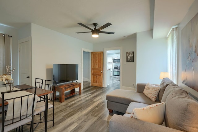 202 Boyleston Ave, Newark, OH 43055 - living area with a ceiling fan, light wood-style flooring, and baseboards