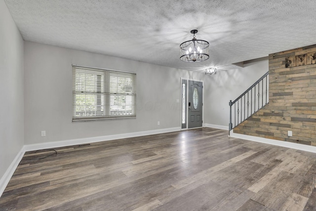 1137 Hoover Lake Ct, Westerville, OH 43081 - entryway with stairs, a chandelier, a textured ceiling, wood finished floors, and baseboards