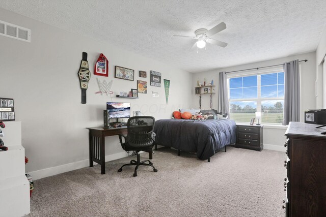 9559 Basil Rd NW, Baltimore, OH 43105 - bedroom featuring light carpet, baseboards, a textured ceiling, and a ceiling fan