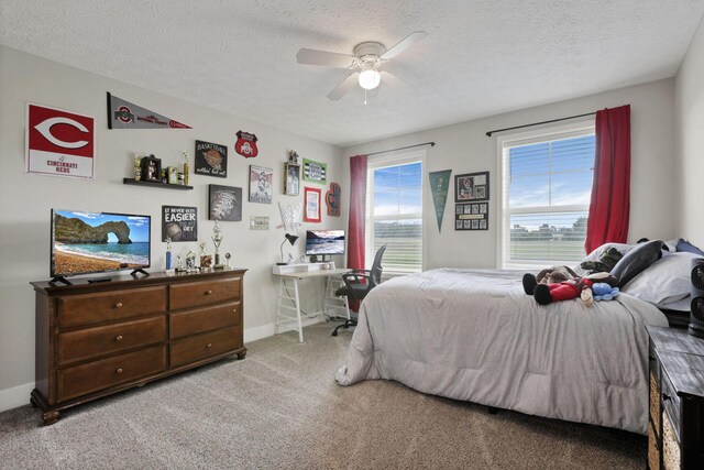 9559 Basil Rd NW, Baltimore, OH 43105 - bedroom with light carpet, baseboards, a textured ceiling, and ceiling fan