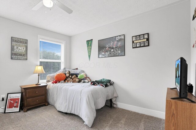9559 Basil Rd NW, Baltimore, OH 43105 - bedroom featuring light carpet, a textured ceiling, baseboards, and a ceiling fan