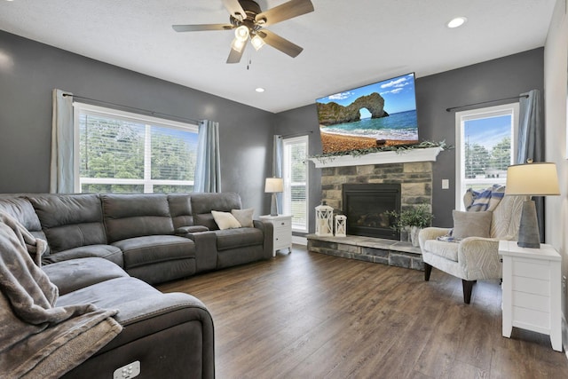 9559 Basil Rd NW, Baltimore, OH 43105 - living area featuring wood finished floors, ceiling fan, plenty of natural light, a stone fireplace, and recessed lighting
