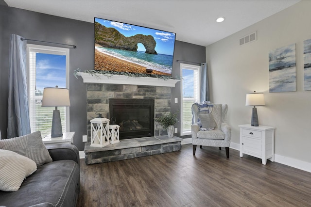9559 Basil Rd NW, Baltimore, OH 43105 - living room with wood finished floors, baseboards, recessed lighting, and a stone fireplace
