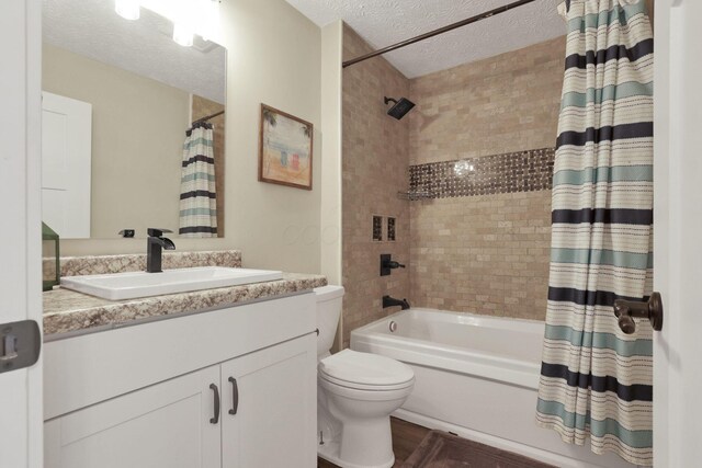 9559 Basil Rd NW, Baltimore, OH 43105 - bathroom with toilet, a textured ceiling, vanity, and shower / bath combo