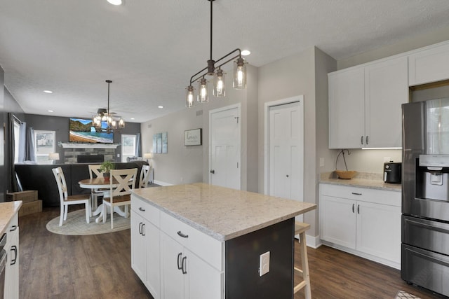 9559 Basil Rd NW, Baltimore, OH 43105 - kitchen featuring stainless steel fridge, dark wood-type flooring, healthy amount of natural light, open floor plan, and recessed lighting