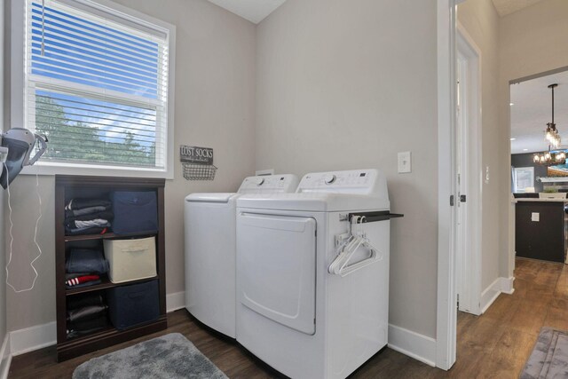 9559 Basil Rd NW, Baltimore, OH 43105 - laundry room with washing machine and dryer, dark wood finished floors, and baseboards