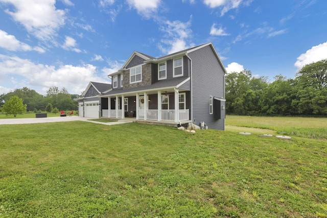 9559 Basil Rd NW, Baltimore, OH 43105 - view of front of property with covered porch, a garage, driveway, and a front yard