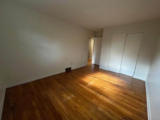 5800 Sandalwood Blvd, Columbus, OH 43229 - unfurnished bedroom featuring wood finished floors and a closet