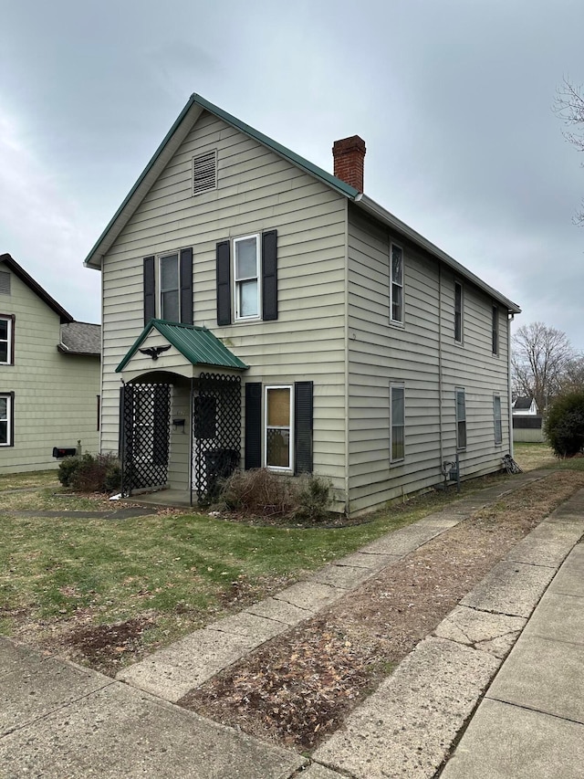 662 Frederick St, Lancaster, OH 43130 - view of front of property with a chimney