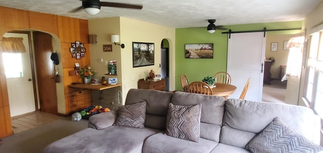 207 Newton Ave, Newark, OH 43055 - living area with ceiling fan, a barn door, and arched walkways
