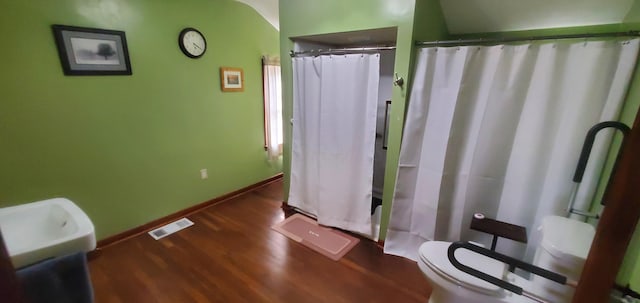 207 Newton Ave, Newark, OH 43055 - bathroom with toilet, wood finished floors, baseboards, and a shower with curtain
