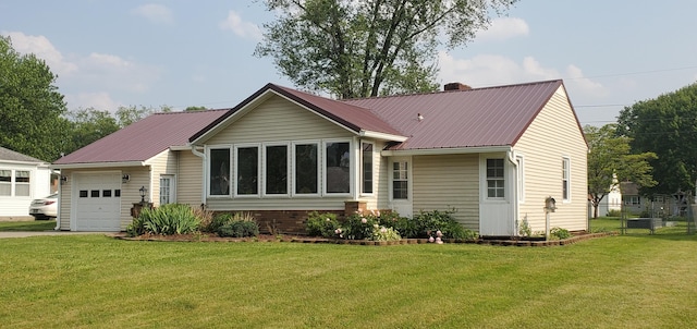 207 Newton Ave, Newark, OH 43055 - rear view of property with metal roof, an attached garage, driveway, and a chimney