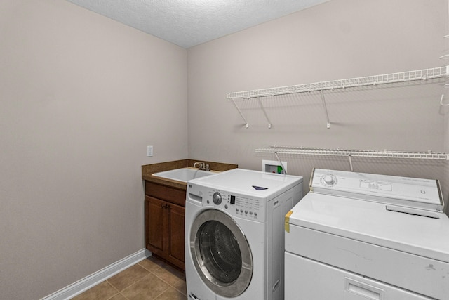 1245 Little Bear Loop, Lewis Center, OH 43035 - washroom with separate washer and dryer, baseboards, cabinet space, light tile patterned floors, and a textured ceiling