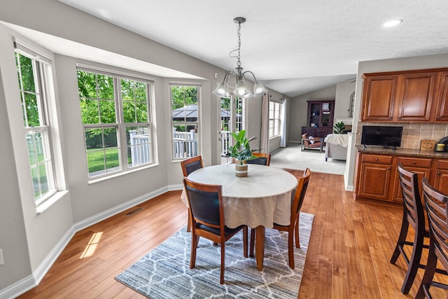 1245 Little Bear Loop, Lewis Center, OH 43035 - dining room with plenty of natural light, light wood-style flooring, baseboards, recessed lighting, and vaulted ceiling