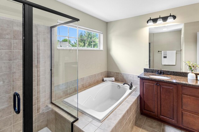 1245 Little Bear Loop, Lewis Center, OH 43035 - bathroom featuring vanity, a bath, a shower stall, and tile patterned floors