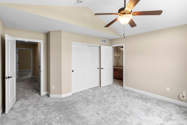 1245 Little Bear Loop, Lewis Center, OH 43035 - unfurnished bedroom featuring light colored carpet, vaulted ceiling, baseboards, a closet, and a ceiling fan