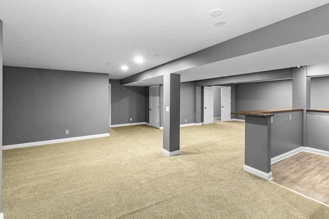 1245 Little Bear Loop, Lewis Center, OH 43035 - finished below grade area with light carpet, baseboards, and recessed lighting