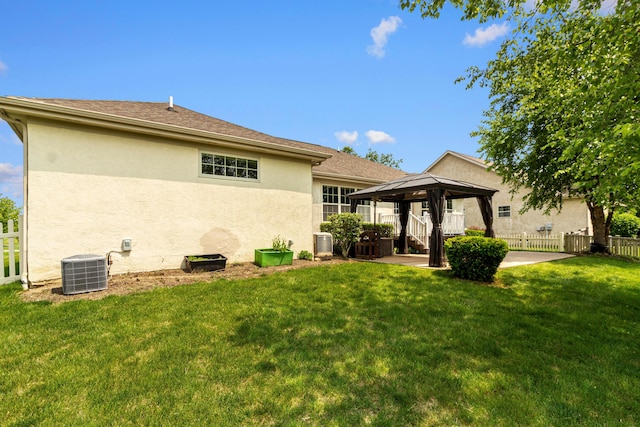 1245 Little Bear Loop, Lewis Center, OH 43035 - back of property featuring a gazebo, stucco siding, cooling unit, and a patio area
