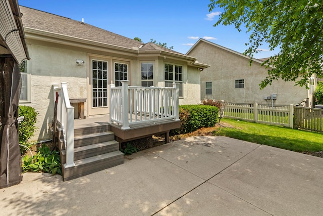 1245 Little Bear Loop, Lewis Center, OH 43035 - back of property with stucco siding, a patio, and a wooden deck