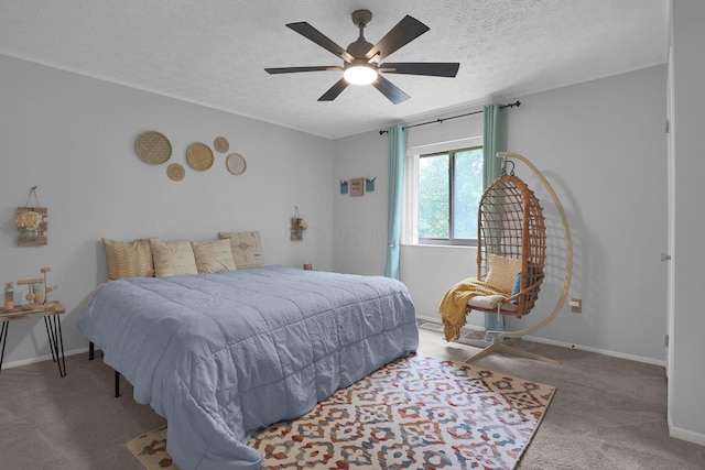 3195 Summerdale Ln, Columbus, OH 43221 - bedroom with carpet floors, a textured ceiling, a ceiling fan, and baseboards