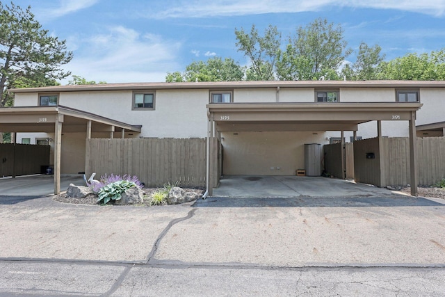 3195 Summerdale Ln, Columbus, OH 43221 - view of front facade with stucco siding and covered parking