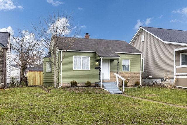 926 E 19th Ave, Columbus, OH 43211 - view of front of home with a chimney and a shingled roof