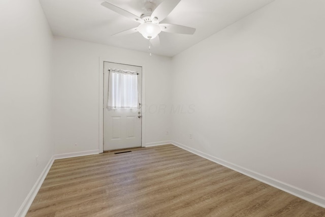 895 Caniff Rd, Columbus, OH 43221 - spare room featuring baseboards and light wood-style flooring