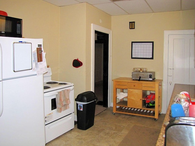 236 E Lane Ave, Columbus, OH 43201 - kitchen featuring fridge, electric stove, and black microwave