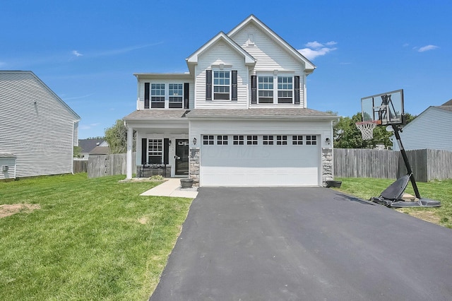1598 Metcalfe Ave, Obetz, OH 43207 - view of front of home with asphalt driveway, a garage, and stone siding