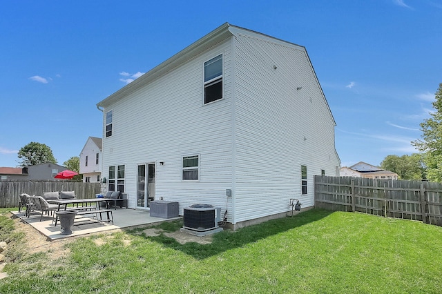 1598 Metcalfe Ave, Obetz, OH 43207 - back of property featuring a patio area, an outdoor living space, and cooling unit