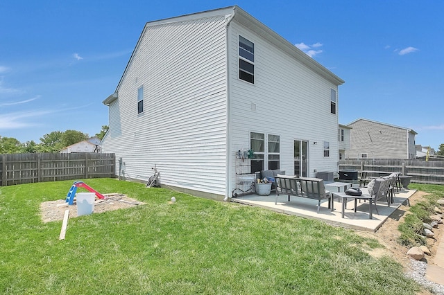1598 Metcalfe Ave, Obetz, OH 43207 - rear view of property with a patio and an outdoor fire pit