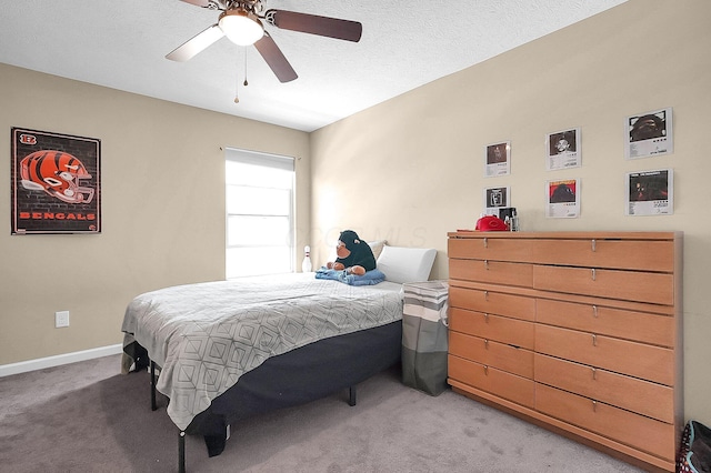 1598 Metcalfe Ave, Obetz, OH 43207 - bedroom featuring light colored carpet, baseboards, and ceiling fan