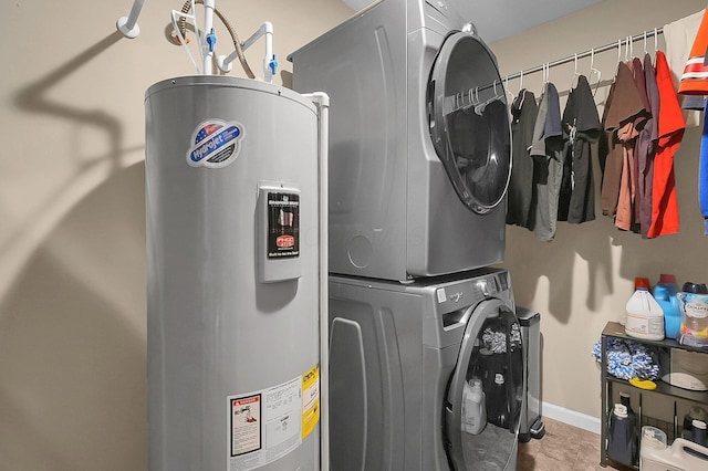 1598 Metcalfe Ave, Obetz, OH 43207 - laundry room featuring stacked washer / dryer, water heater, and baseboards