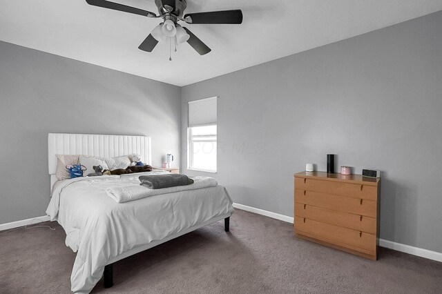 1598 Metcalfe Ave, Obetz, OH 43207 - carpeted bedroom with baseboards and ceiling fan