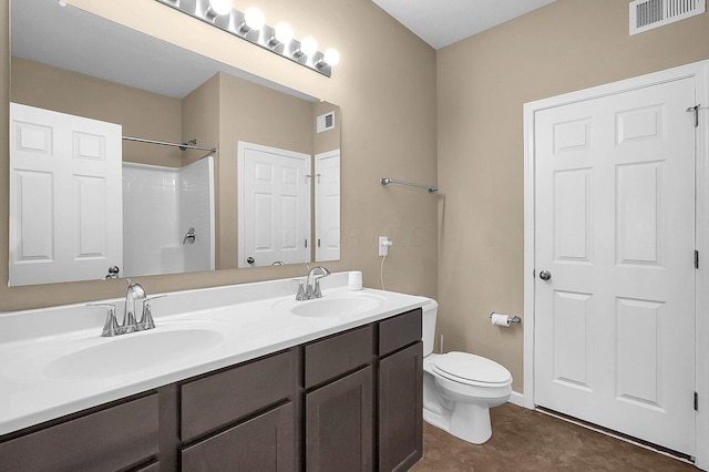 1598 Metcalfe Ave, Obetz, OH 43207 - full bath featuring double vanity, toilet, a shower, and tile patterned flooring