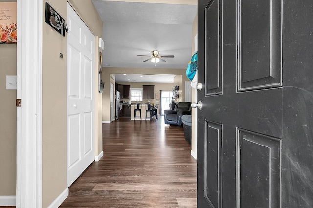 1598 Metcalfe Ave, Obetz, OH 43207 - entrance foyer featuring a ceiling fan, dark wood-type flooring, and baseboards