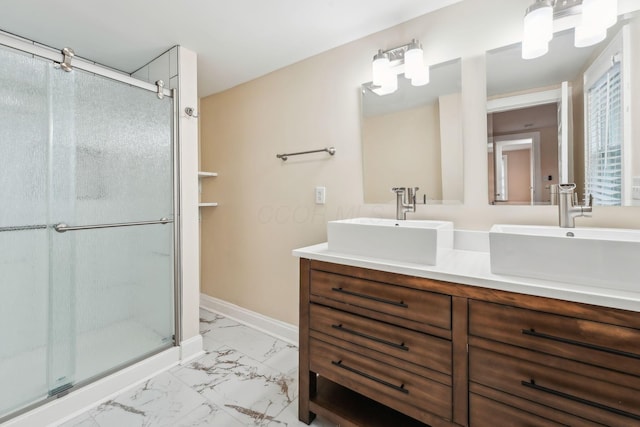 943 S Champion Ave, Columbus, OH 43206 - bathroom with marble finish flooring, a shower stall, double vanity, and baseboards
