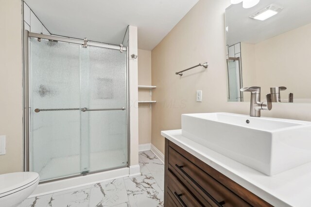 943 S Champion Ave, Columbus, OH 43206 - full bathroom featuring marble look tile flooring, toilet, vanity, and a stall shower