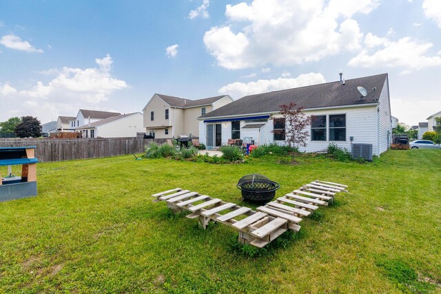 91 Richard Ave, South Bloomfield, OH 43103 - back of property with an outdoor fire pit, cooling unit, and a patio area