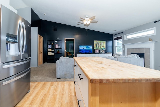 91 Richard Ave, South Bloomfield, OH 43103 - kitchen featuring wooden counters, stainless steel fridge, open floor plan, lofted ceiling, and light wood-style flooring