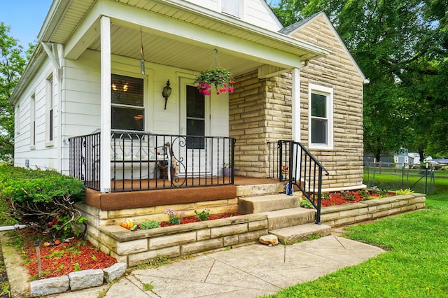 2506 Chester Rd, Columbus, OH 43231 - doorway to property with a porch and stone siding