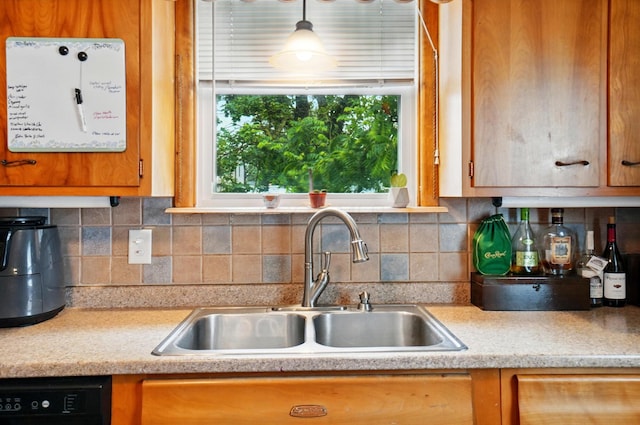 2506 Chester Rd, Columbus, OH 43231 - kitchen featuring a sink, light countertops, decorative backsplash, and black dishwasher