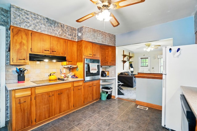 2506 Chester Rd, Columbus, OH 43231 - kitchen with a ceiling fan, stainless steel appliances, under cabinet range hood, tasteful backsplash, and brown cabinets