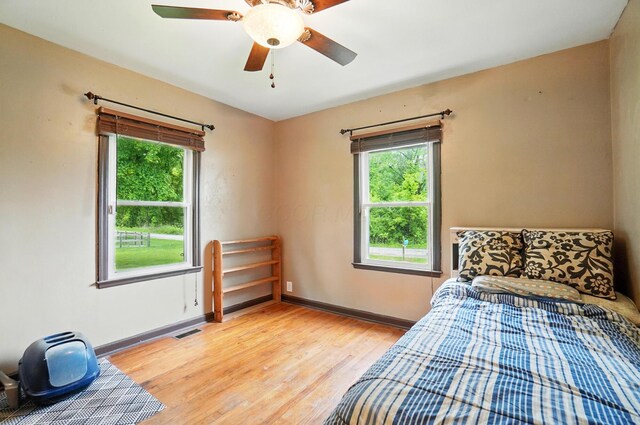 2506 Chester Rd, Columbus, OH 43231 - bedroom featuring light wood-type flooring, baseboards, and ceiling fan