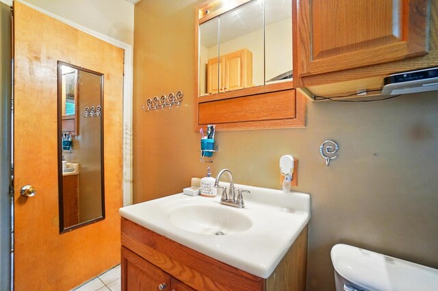 2506 Chester Rd, Columbus, OH 43231 - half bath featuring toilet, vanity, and tile patterned flooring